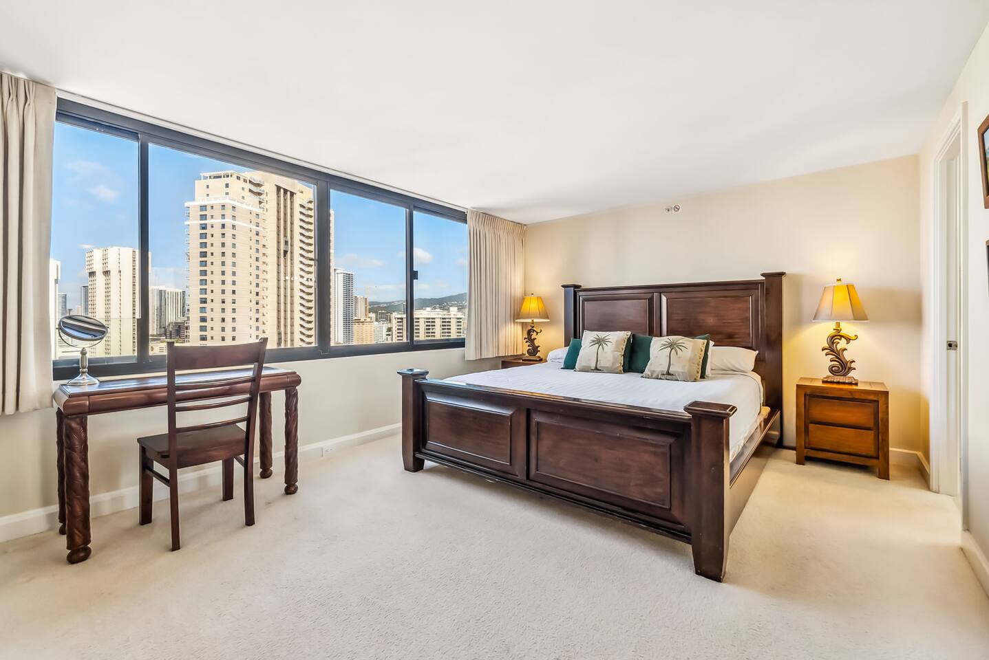 Relax in the serene master suite, featuring a king-sized bed, a spacious walk-in closet, and a modern en-suite bathroom.
