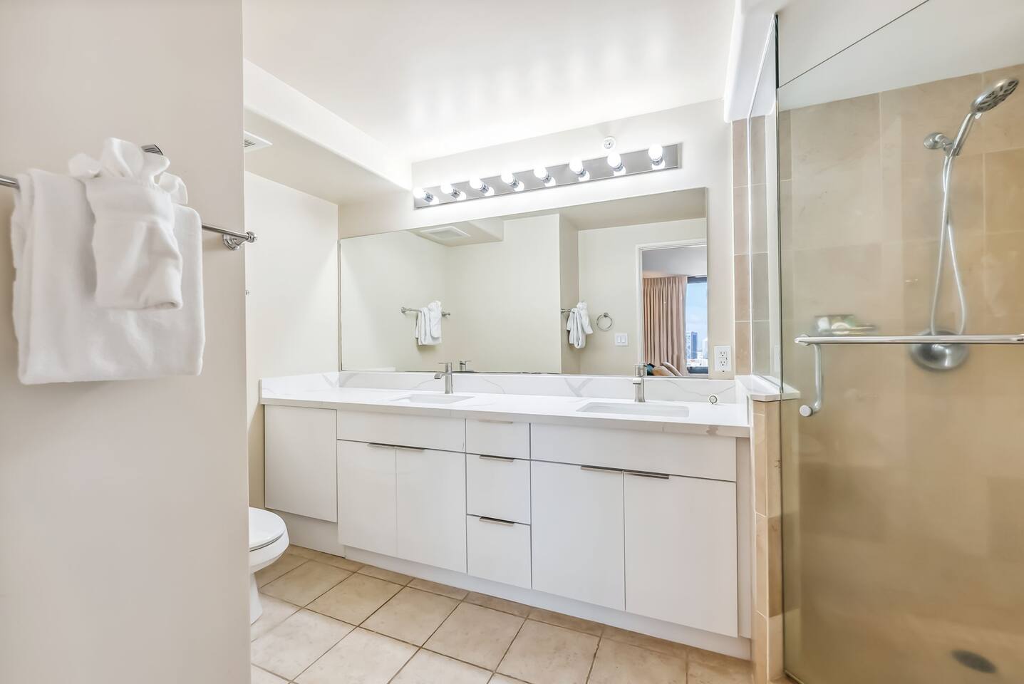 Indulge in the spacious master bath, featuring a double vanity and a luxurious walk-in shower—your personal retreat for relaxation and rejuvenation.