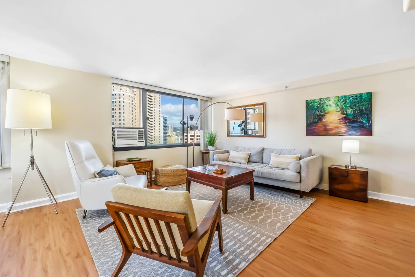 The stylish living room is the heart of the condo, offering an ocean breeze, cozy seating, and all the comforts of home. A perfect place to gather and relax!