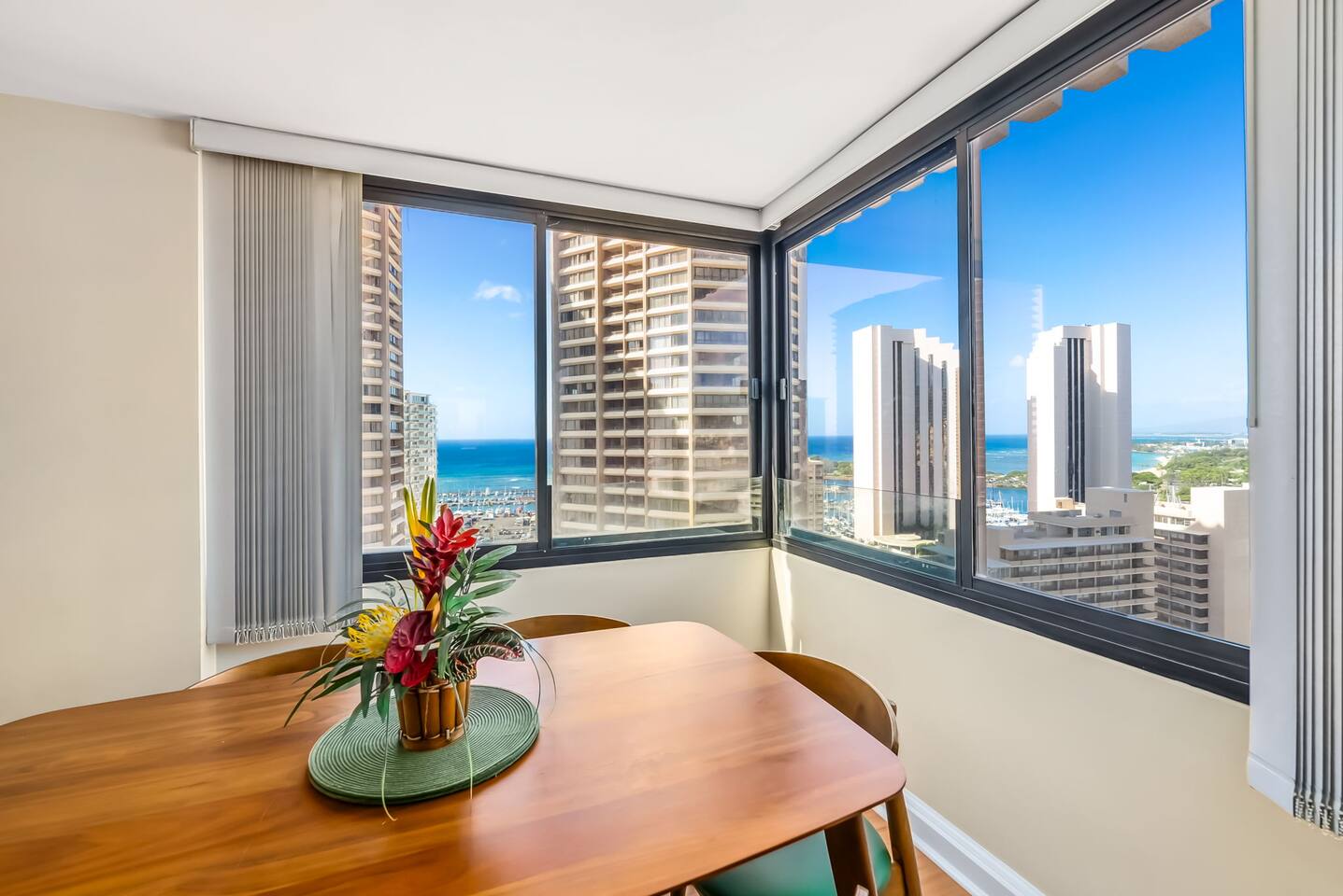 The large windows offer incredible views and natural light, creating the perfect atmosphere for your Hawaiian getaway.
