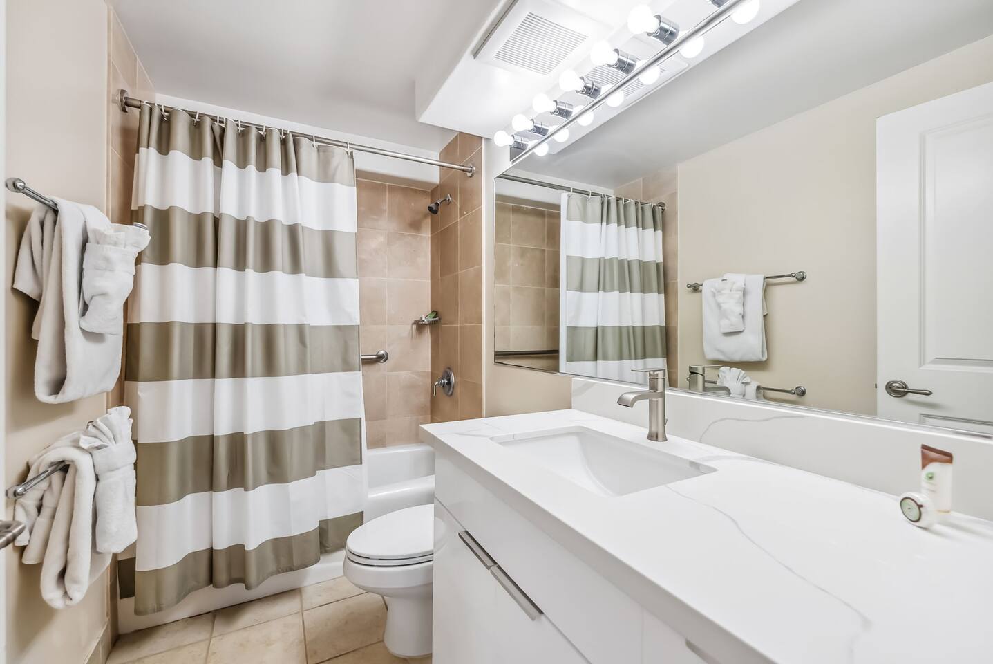 A luxurious bathroom awaits in the second master suite, complete with a tub/shower combo, perfect for relaxing after a busy day of sight-seeing.