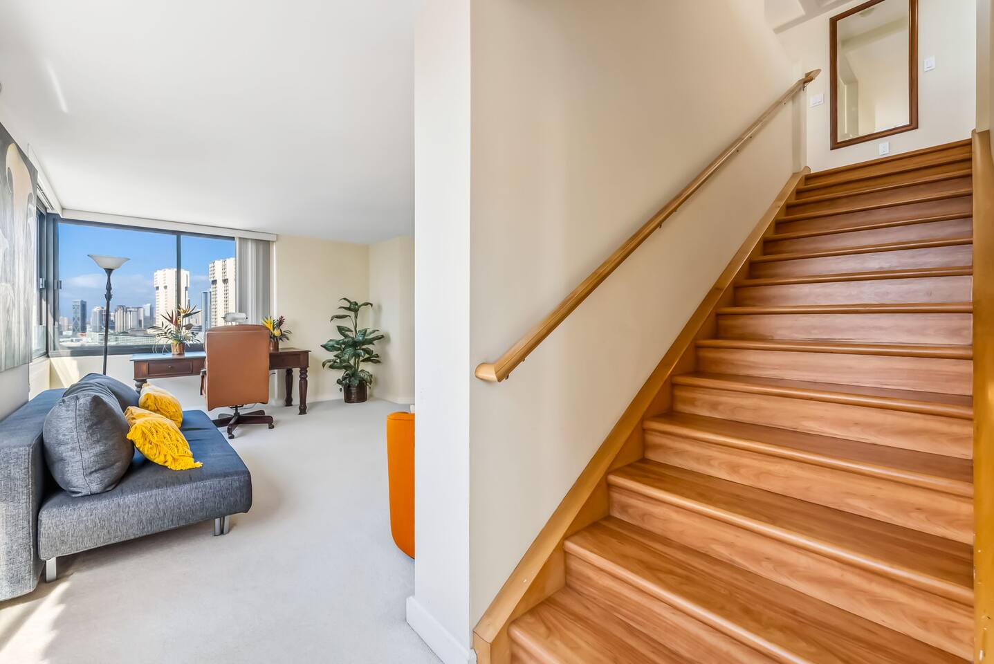 At the bottom of the stairs you'll find the Twin master suite to your left, and the den area and office to your right.