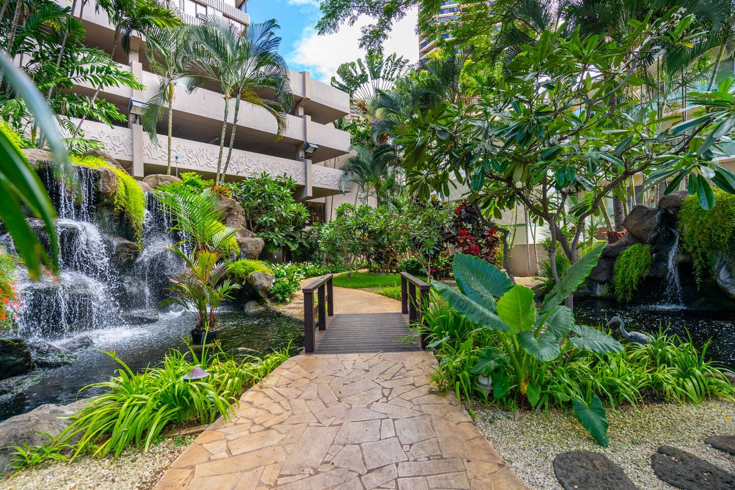 Enter the Windsor Waikiki through a pathway lined with tranquil waterfall features, setting the tone for a peaceful and serene stay from the moment you arrive.