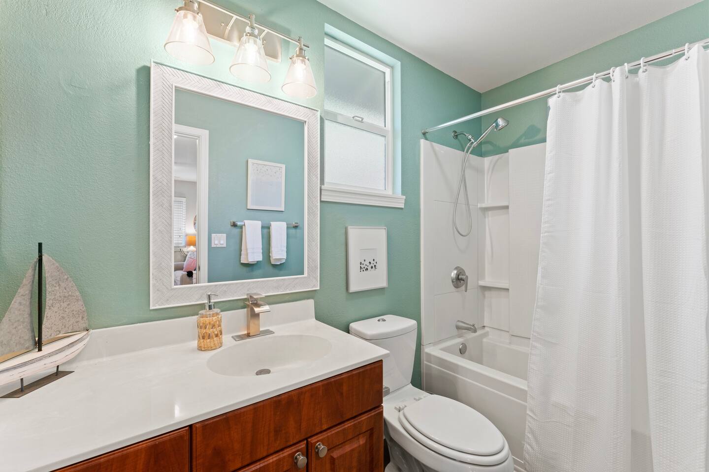 Fresh, bright, and thoughtfully styled this bathroom brings a touch of coastal charm to your daily routine.