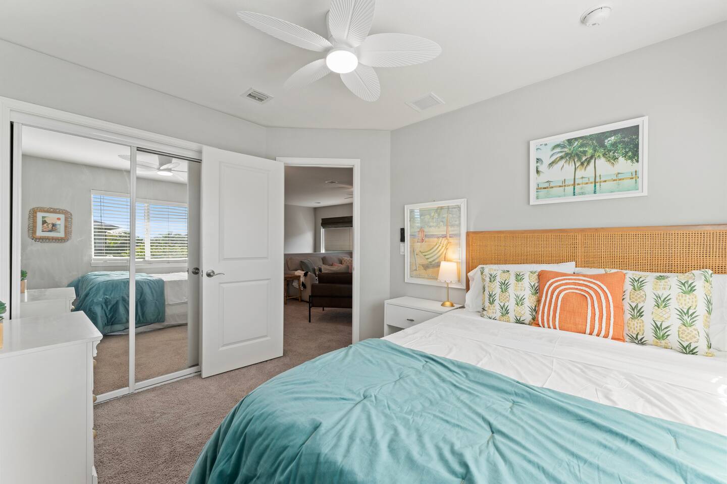 Featuring a mirrored closet and ceiling fan, this space offers comfort and convenience.