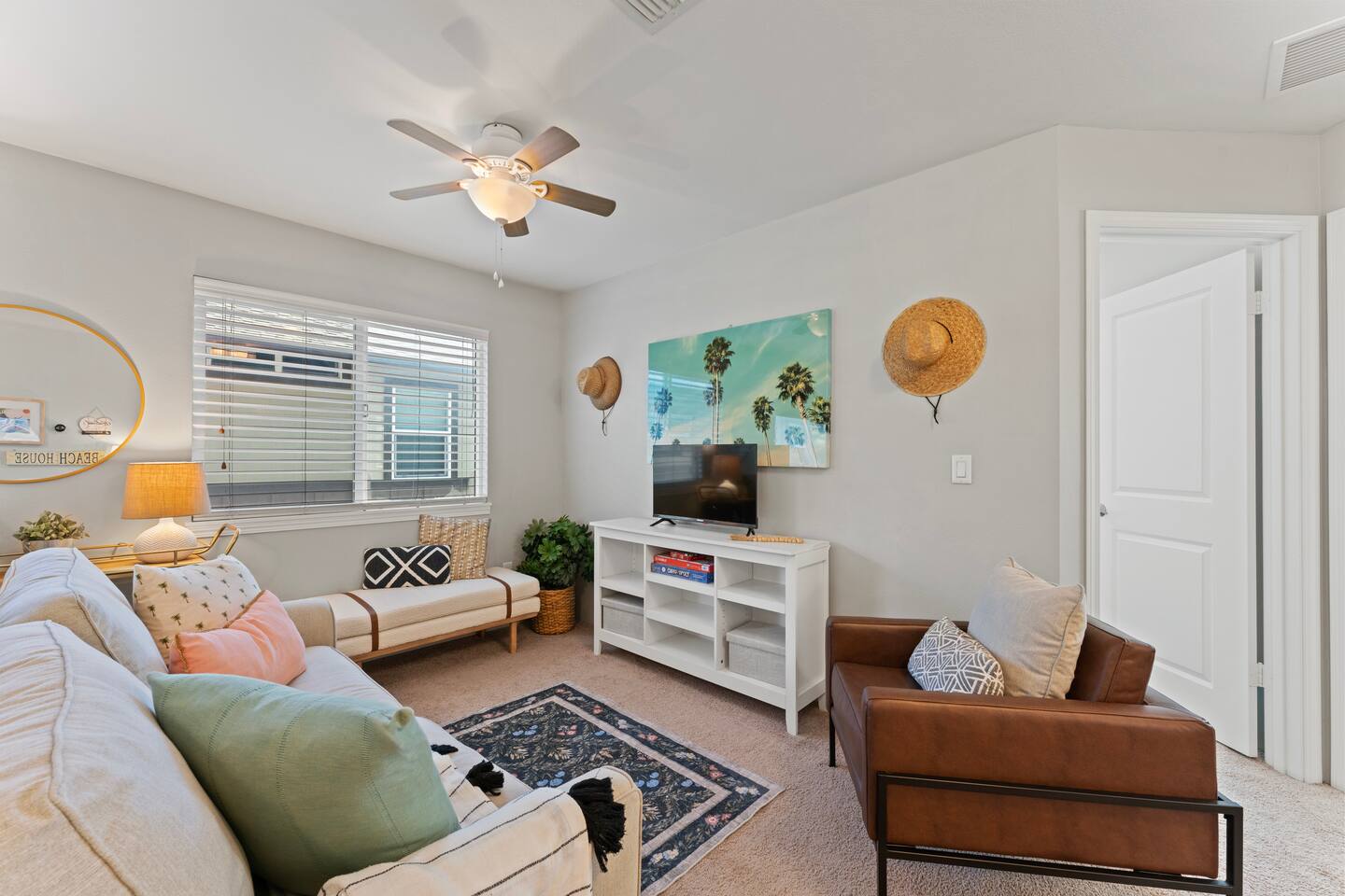 Casual comfort meets tropical charm in this cozy corner made for relaxing and recharging.