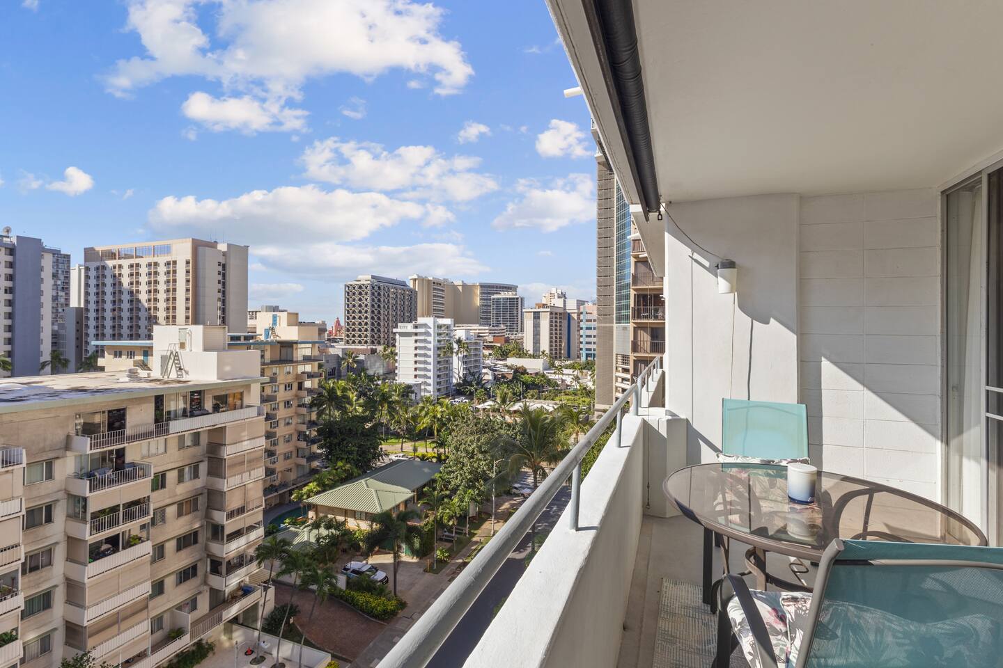 Lanai with sweeping city views just steps from Waikiki’s top attractions-perfect for enjoying the island breeze.