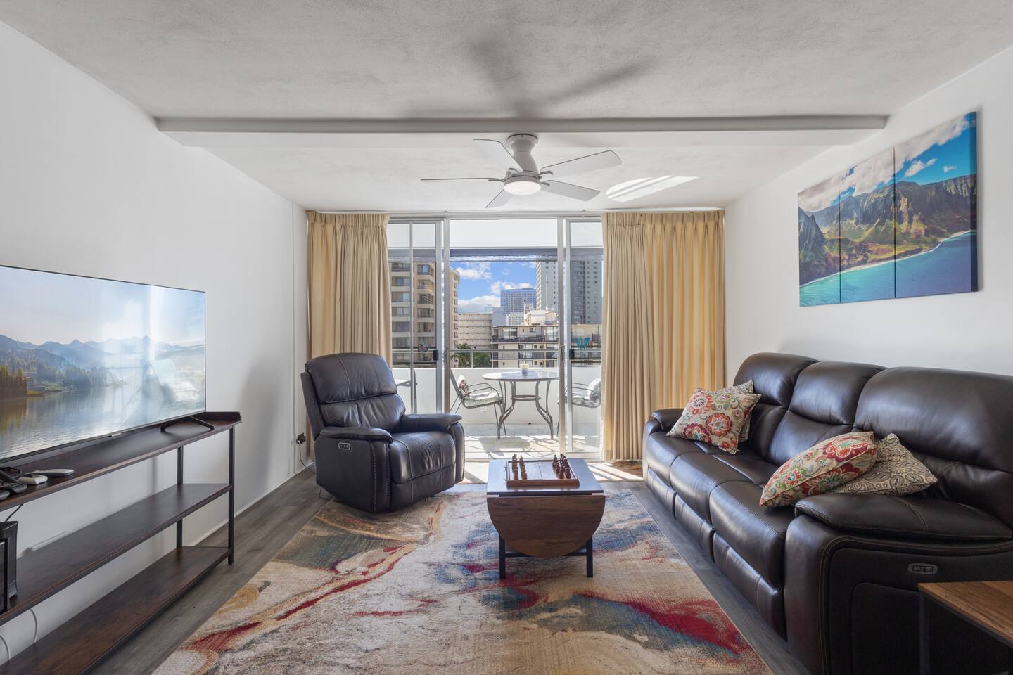 Enjoy natural light pouring in through the sliding glass doors, creating an airy, inviting living space with views of the city.