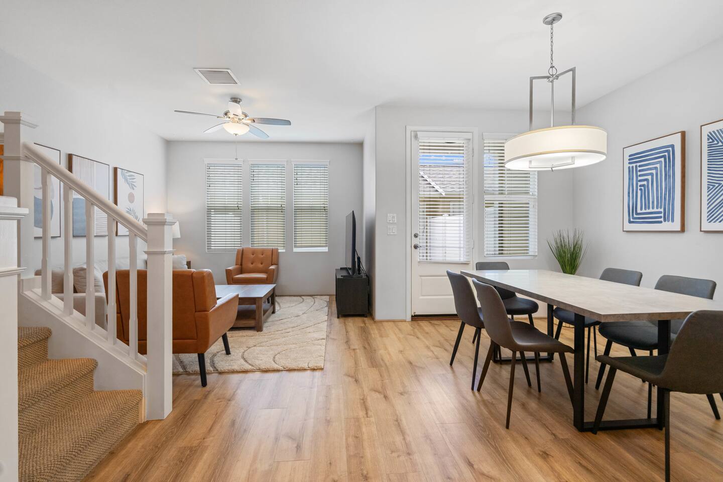 Bright open-concept living and dining area with modern décor-perfect for relaxing or entertaining.