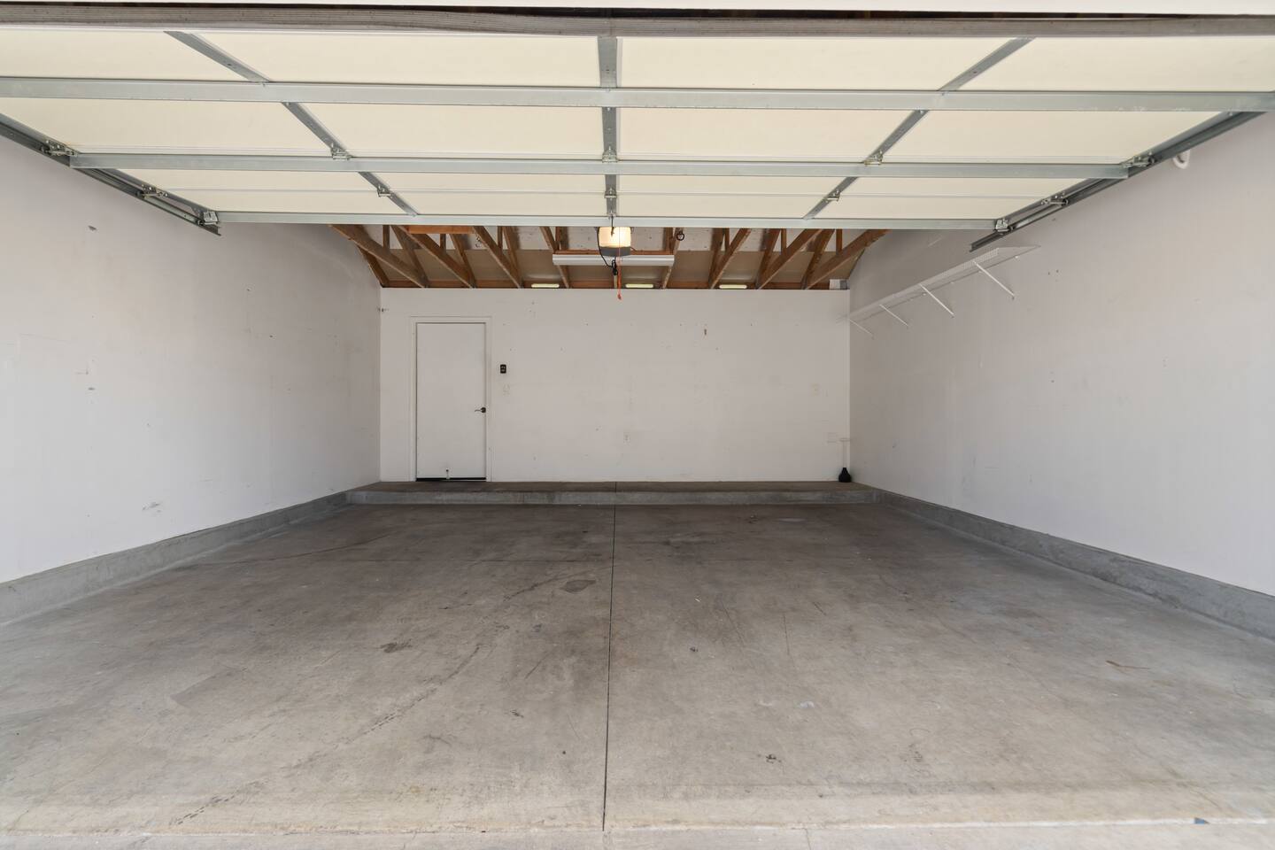 Spacious two-car garage with plenty of room for parking and extra storage.