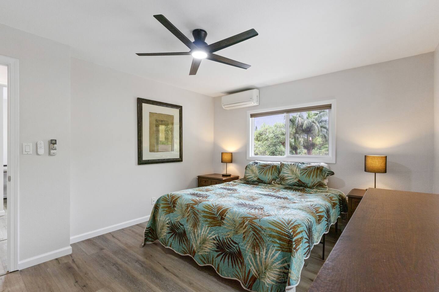 Tranquil island-style bedroom with lush views and breezy tropical décor for ultimate relaxation.