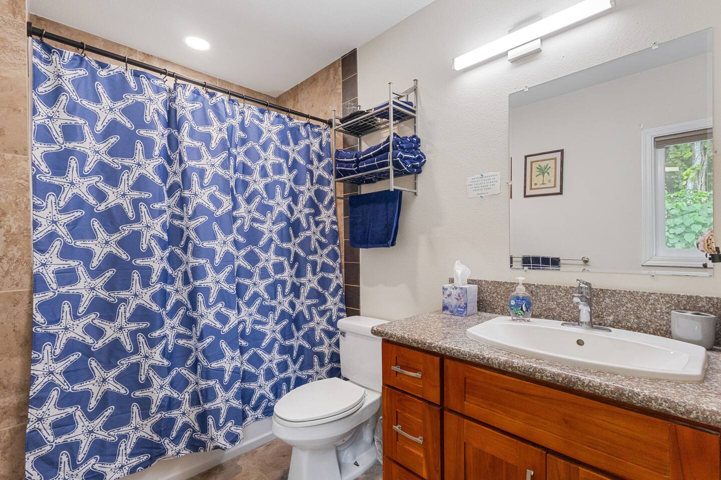 Clean, comfy, and coastal - this en-suite bathroom is stocked with everything you need!