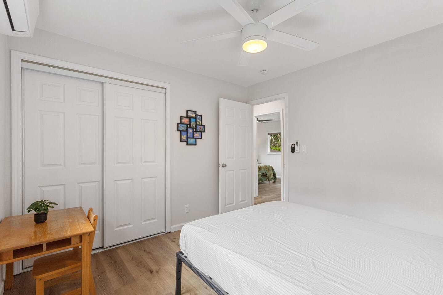 This bedroom features a spacious closet and a cozy desk area-perfect for storage, work, or study.