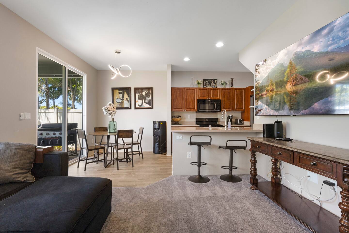 Open space featuring both bar seating and a cozy dining area-perfect for meals, entertaining, or relaxing with friends and family.