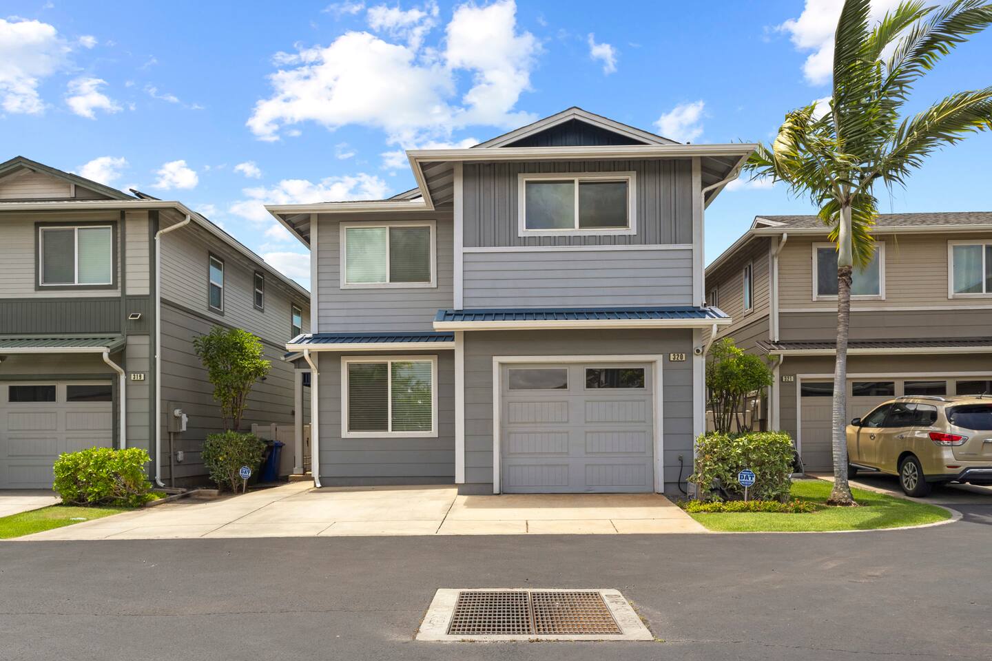 This charming two-story home features a convenient single-car garage and a clean, welcoming exterior.