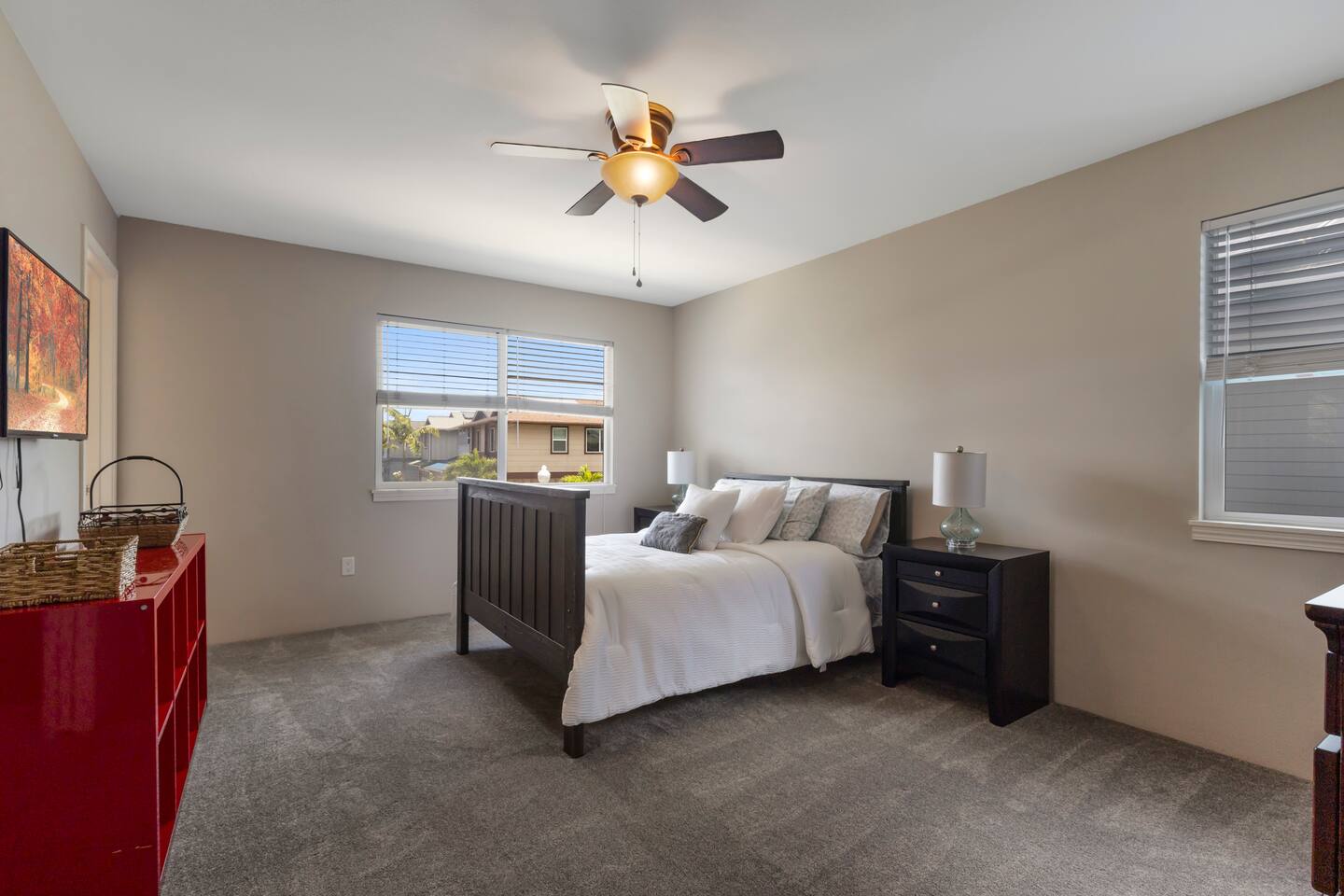 Time to get cozy in this spacious master bedroom, featuring a plush queen bed.