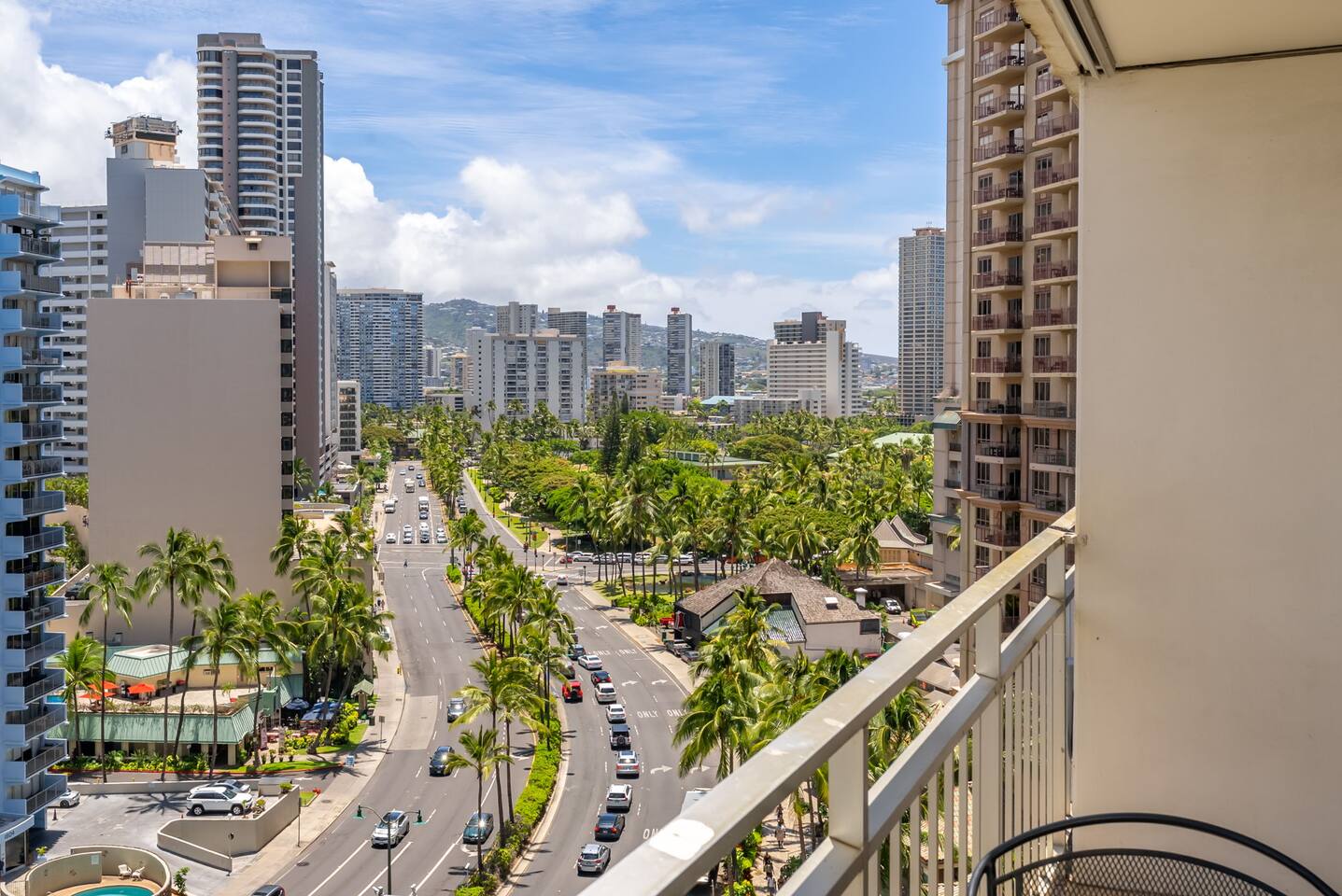 Palm trees, skyline, and street life-enjoy the view from your private perch.