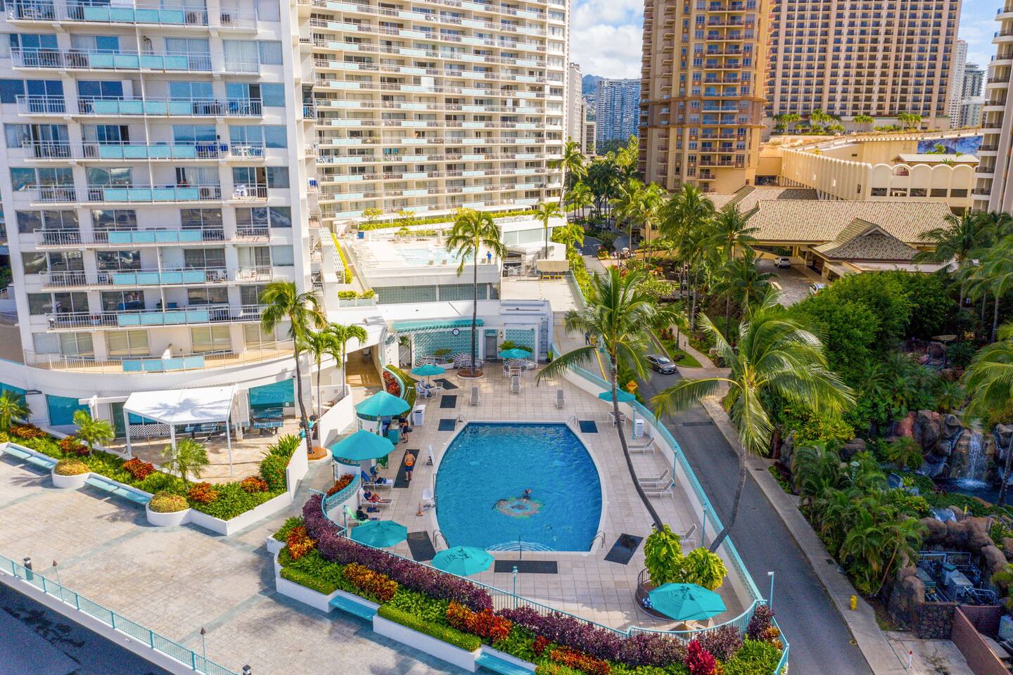 Escape the buzz with poolside peace and palm-shaded lounging.