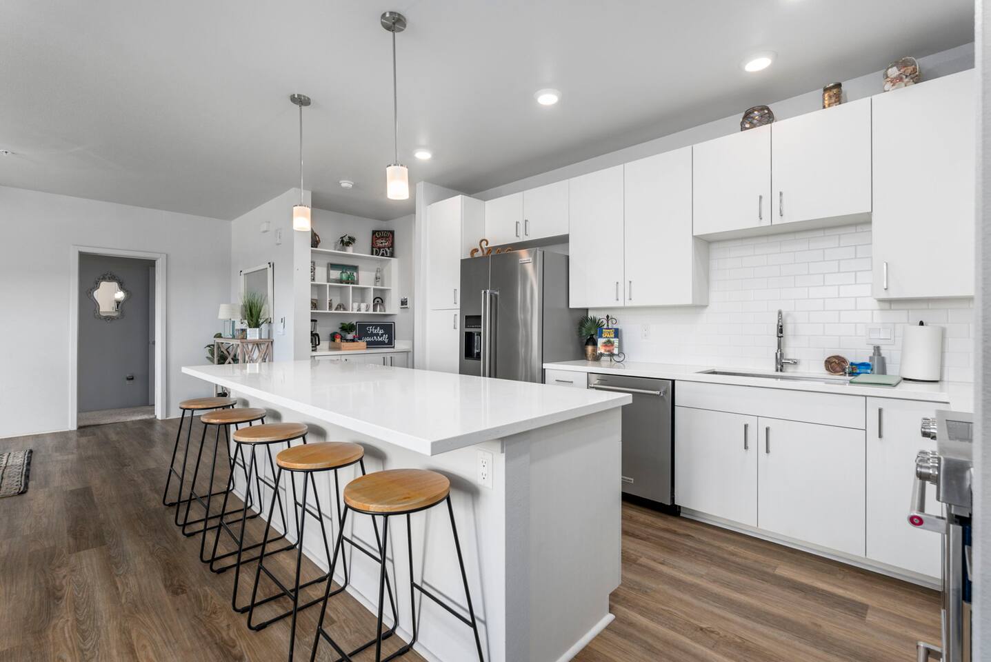 Make yourself at home! When you walk into the beautifully lit kitchen, you'll feel invited to settle in right away.