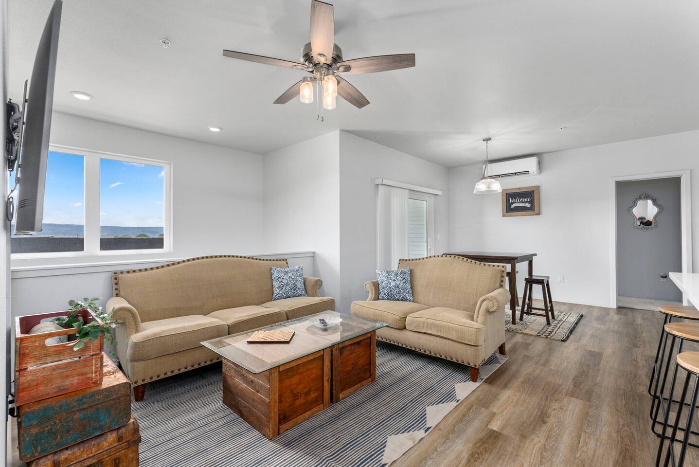 Get comfortable on the plush sofas while staying cool, thanks to the split A/C unit.