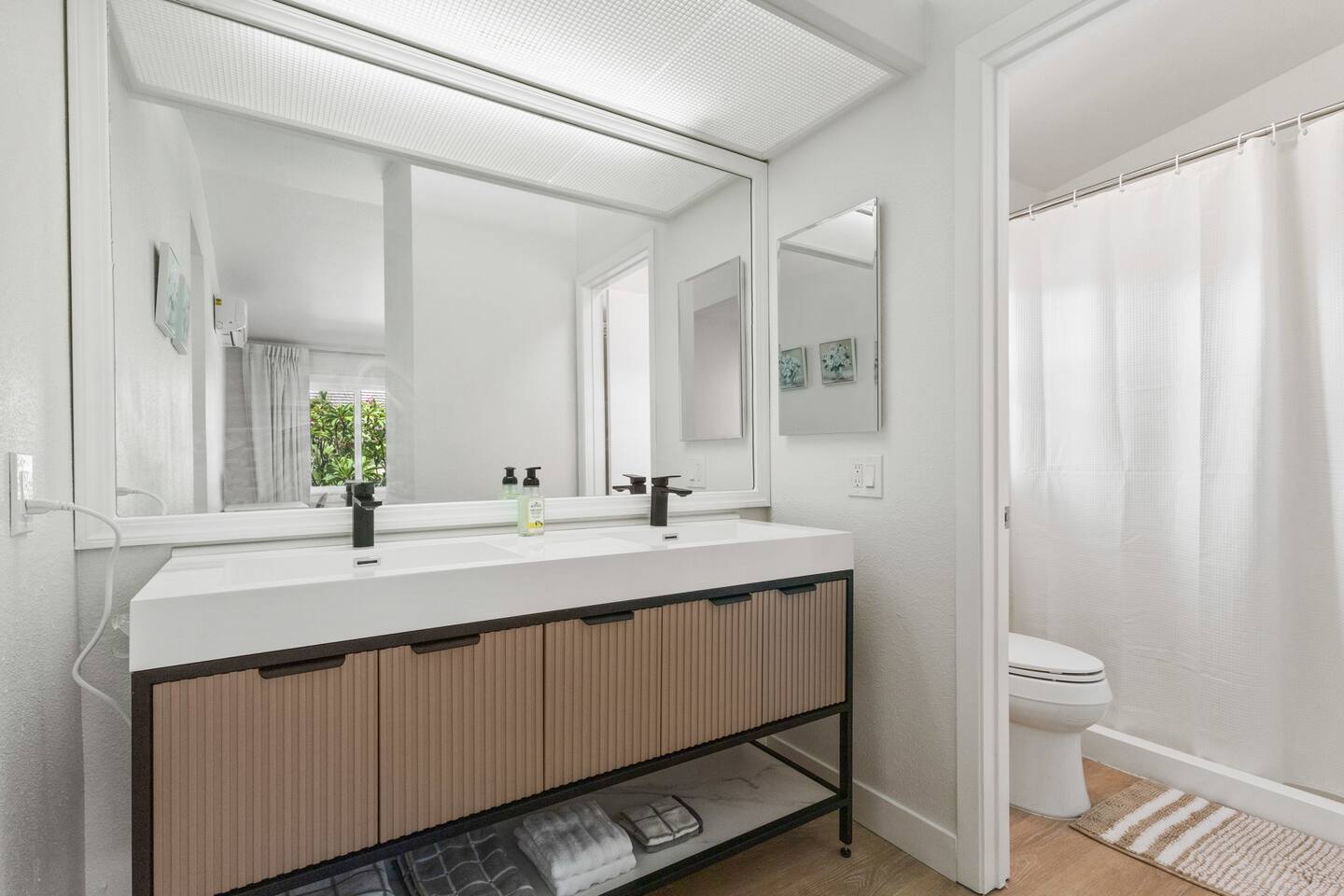 Modern bathroom with double vanity and plenty of space.