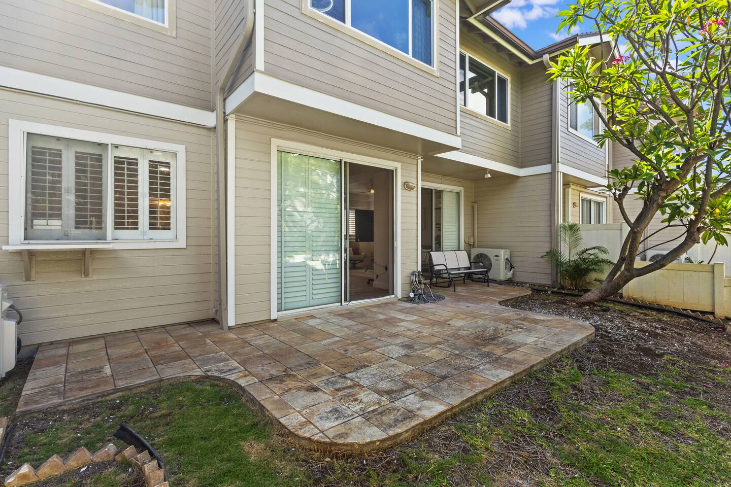 Private patio with seating to unwind and enjoy the breeze