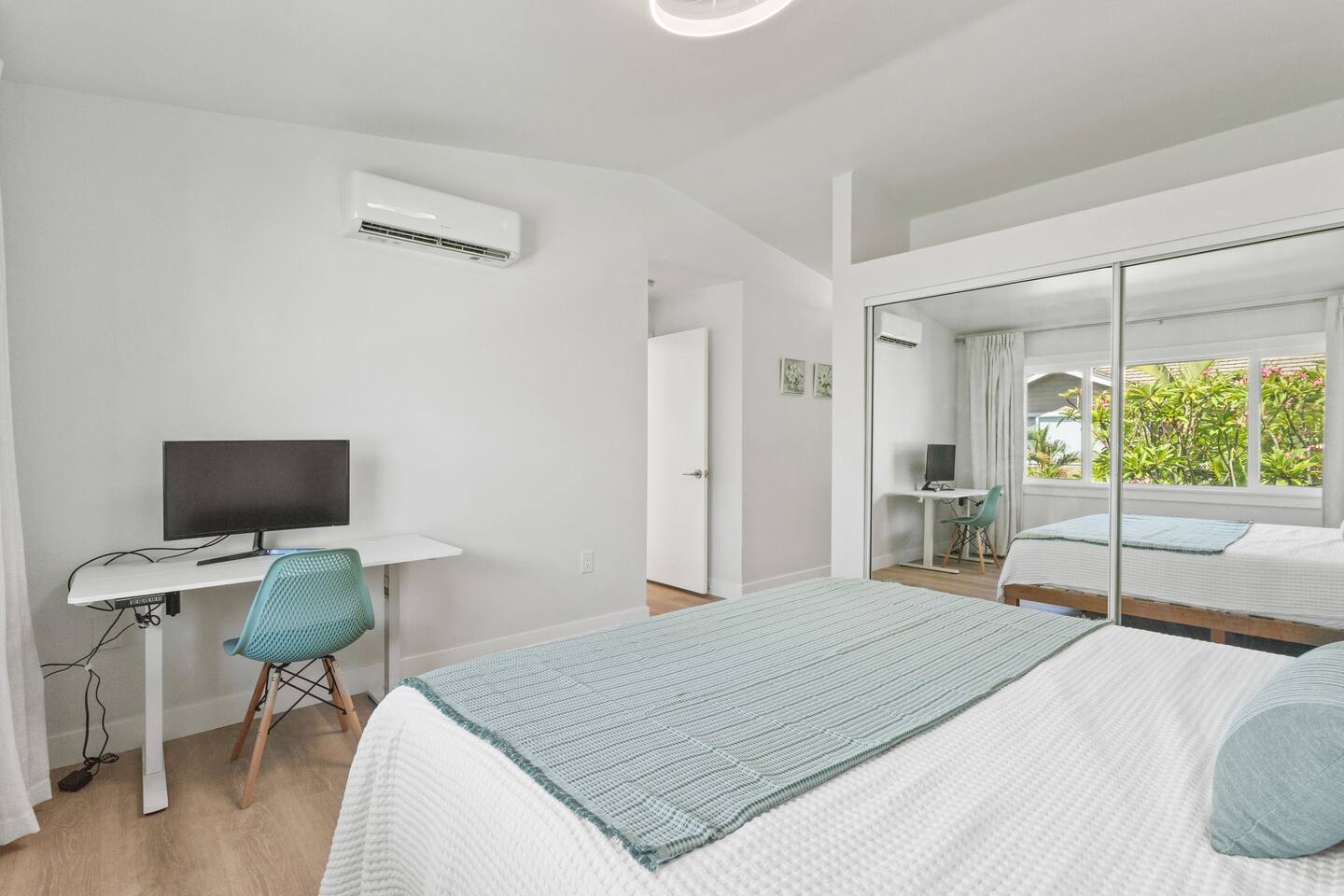 Bedroom with ample closet space and natural light.