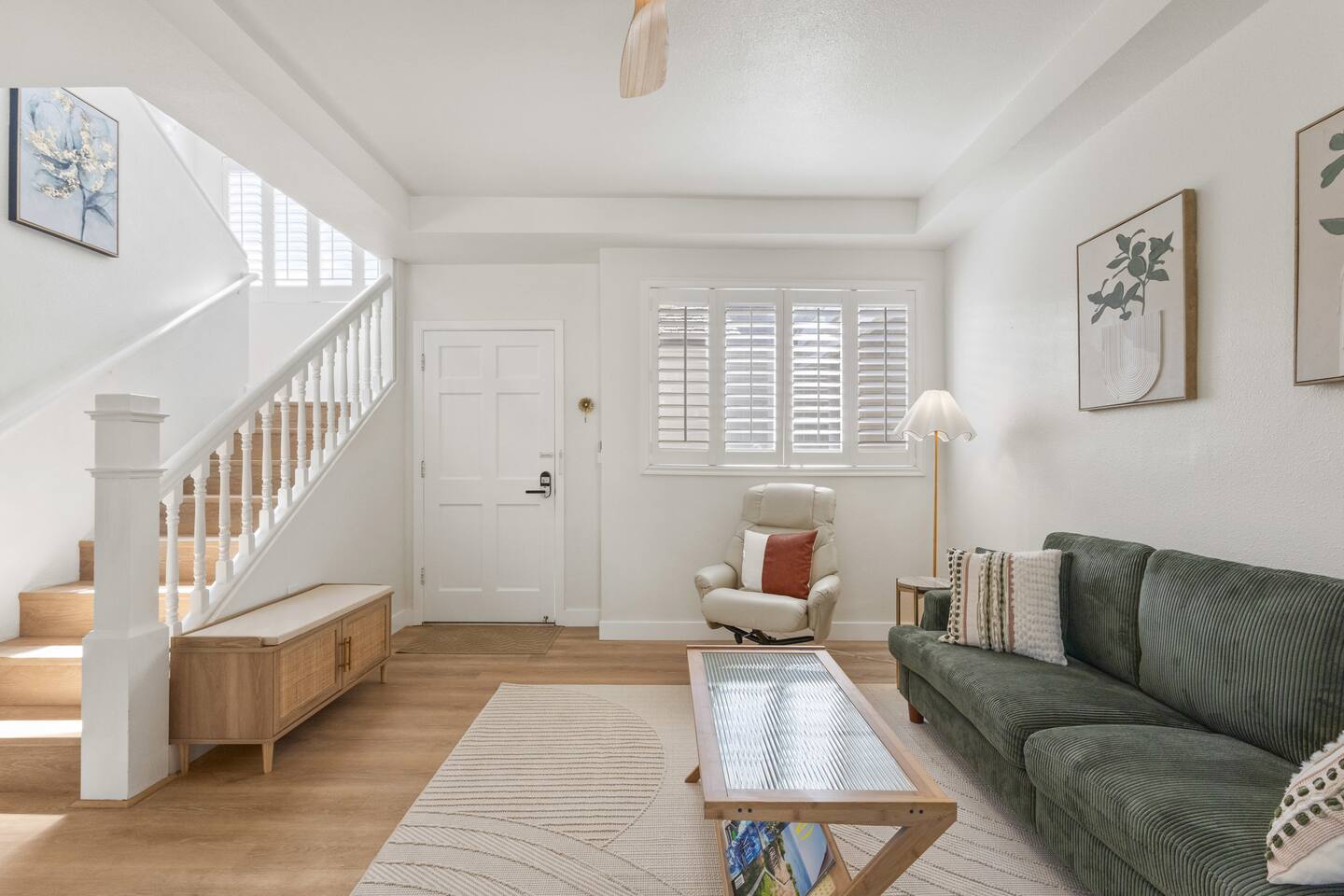 Open-concept living room filled with natural light.