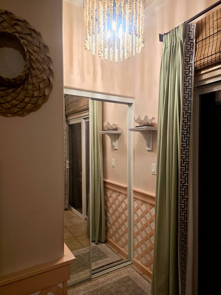 A graceful entryway with mirrored reflections and cozy textures sets the tone for your stay.
