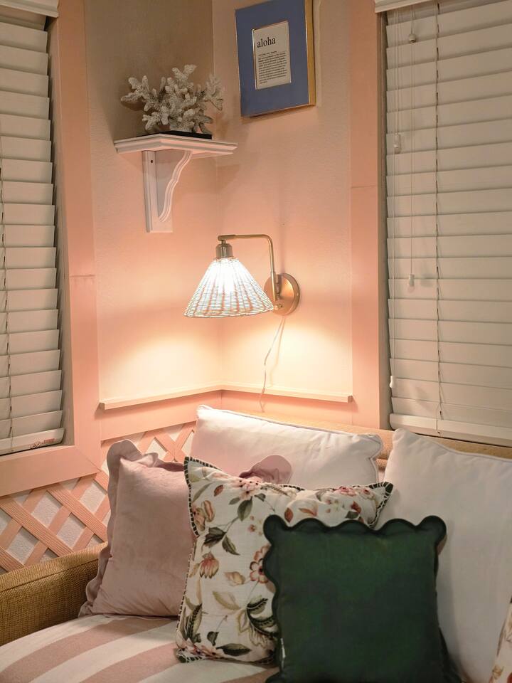Warm lighting and layered textures create a peaceful retreat perfect for reading or unwinding