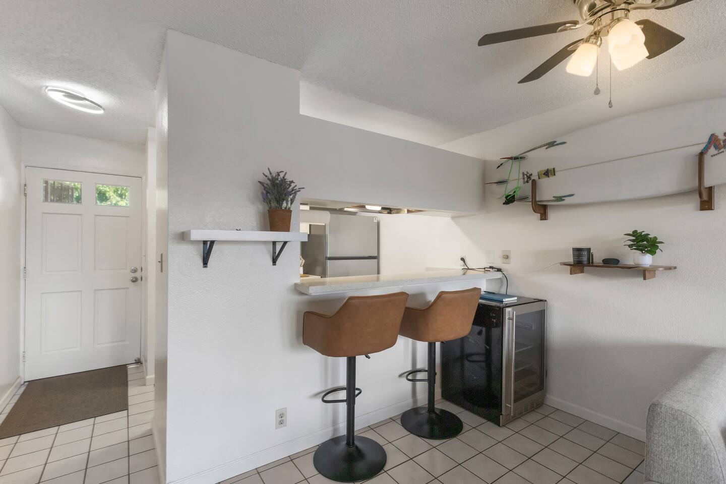 With clean lines, cozy seating, and playful coastal touches, this space feels like home.