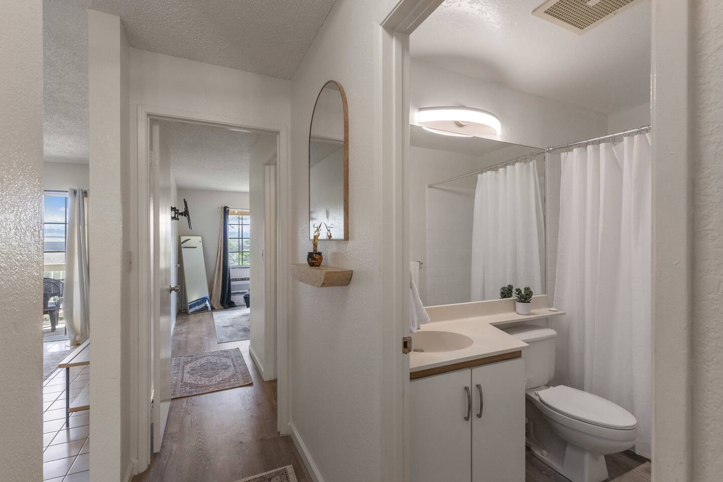 Neutral tones, natural light, and a touch of greenery make this space feel like your own private retreat. Clean, quiet, and inviting.