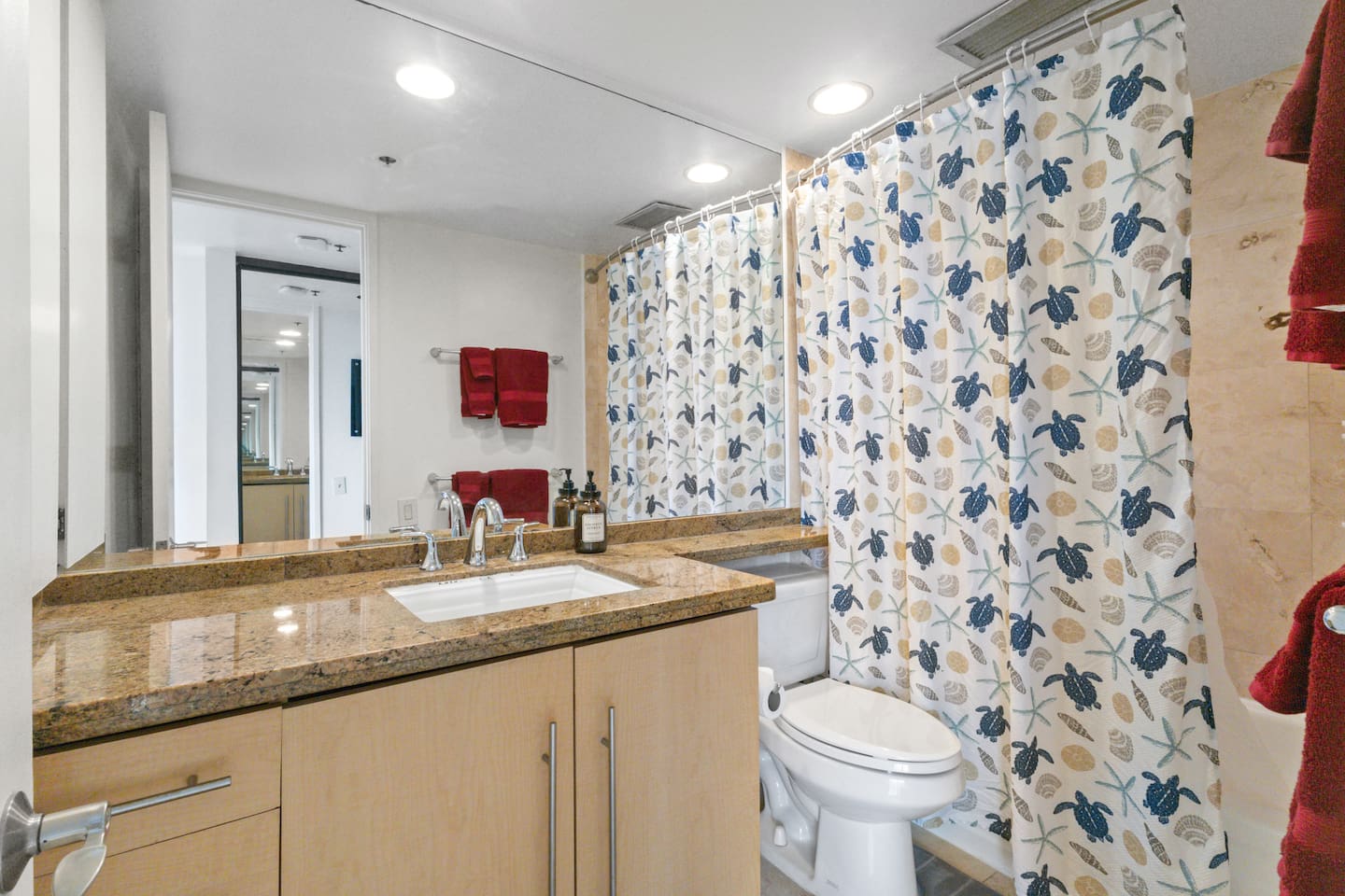 Spacious granite vanity and tropical touches bring comfort to your daily routine.