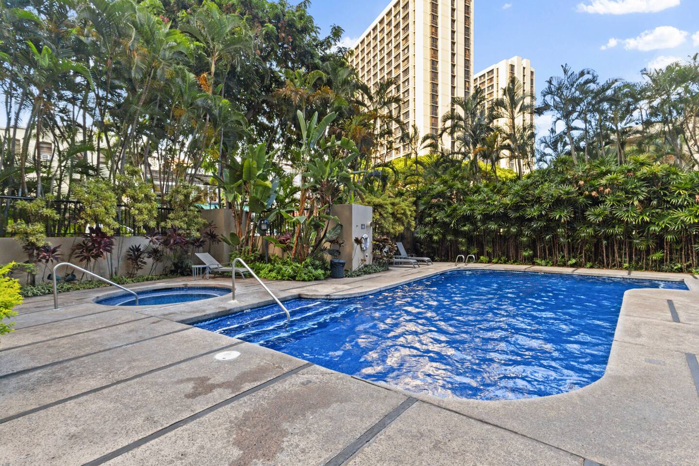 Enjoy the private pool and spa under the palms!