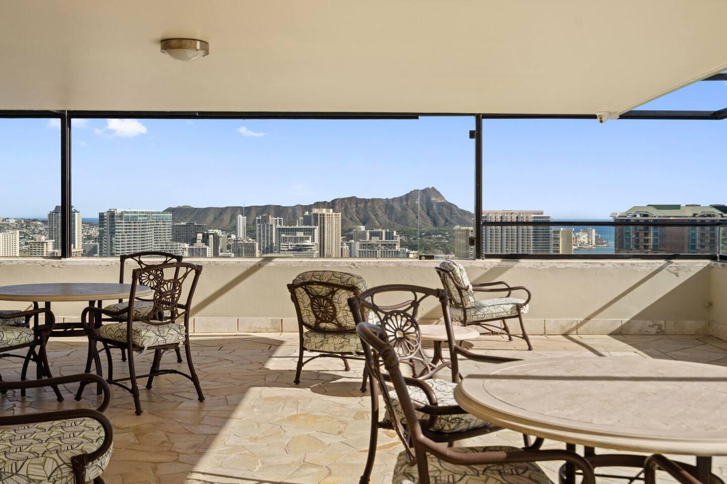 Glass panels, blue expanse, and a touch of flair. This rooftop blends style with serenity. Your elevated escape awaits.