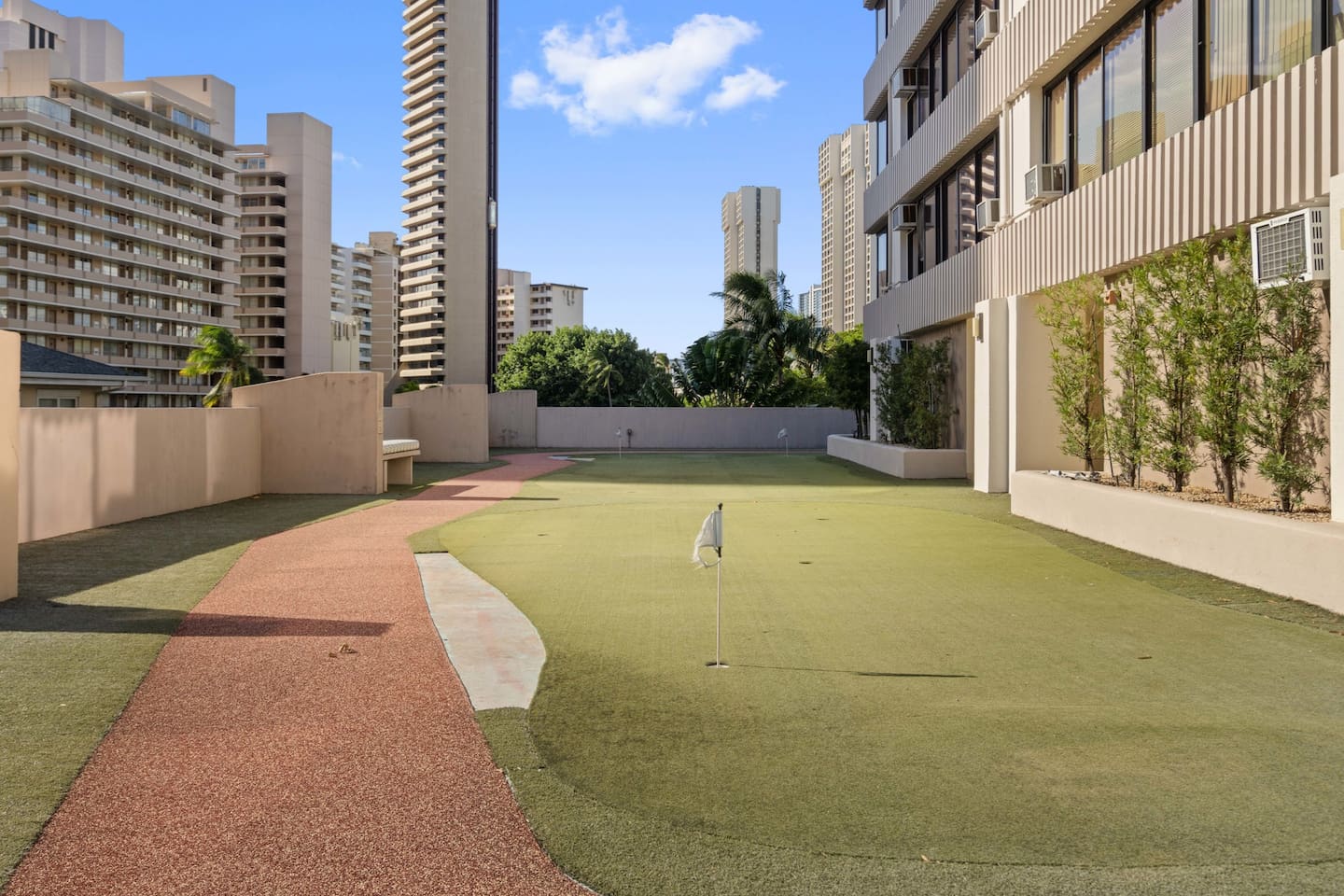 Practice your short game with a view. Curved paths, clean turf, and tropical calm. Honolulu recreation, right outside your door.