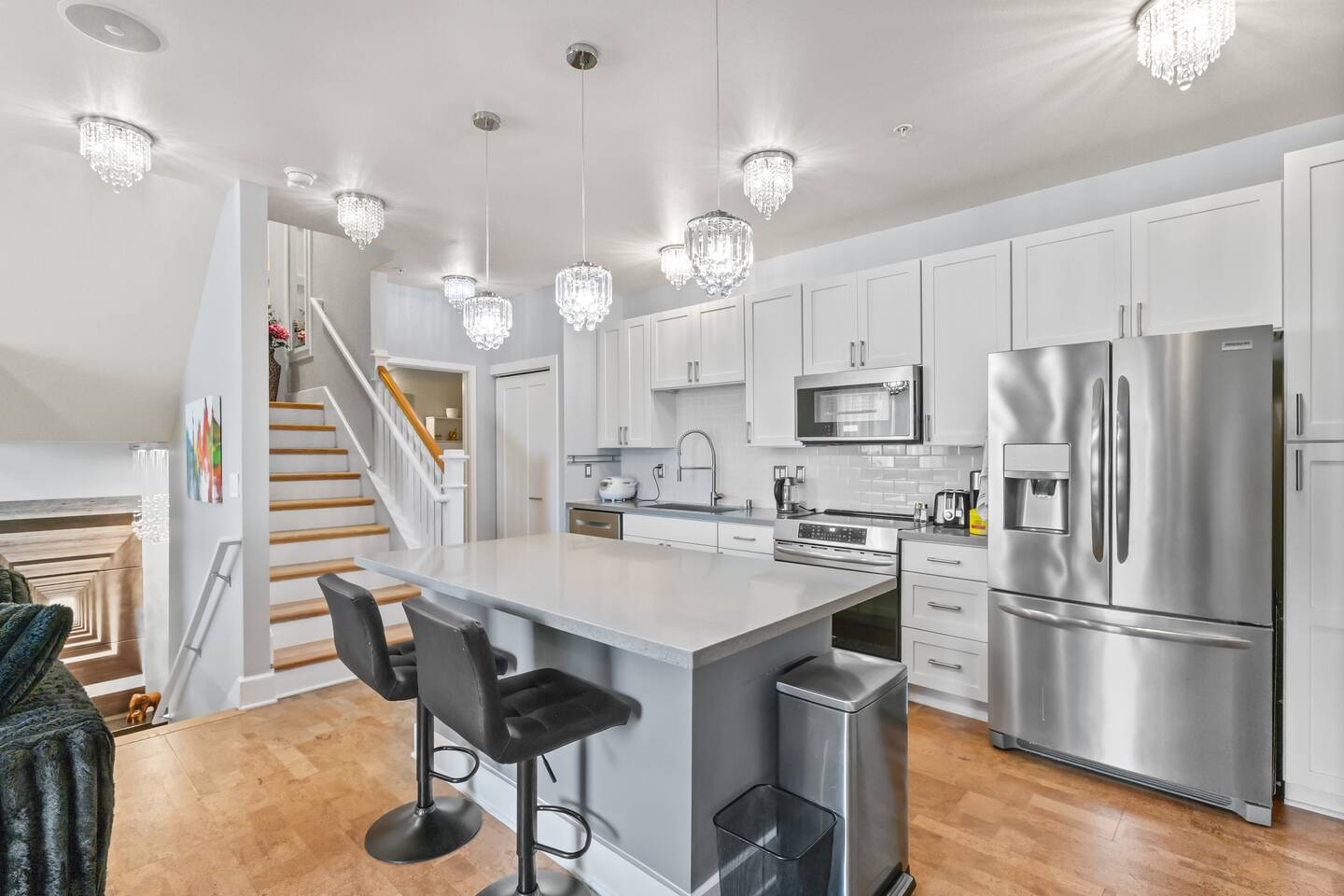 Prep meals, sip coffee, and gather around the island in this bright, modern kitchen with everything you need.
