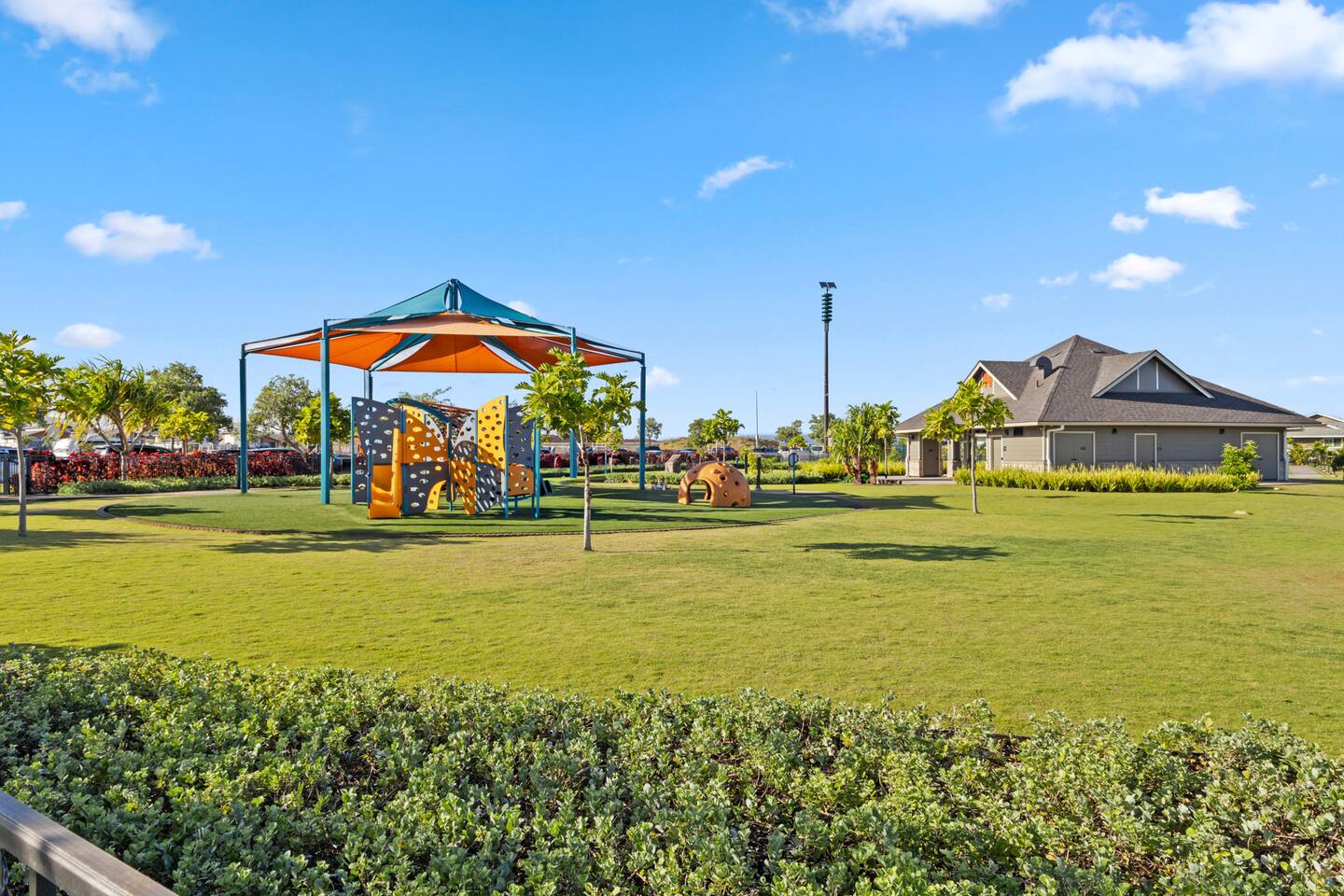 Colorful canopy, soft turf, and playful shapes , this shaded park is perfect for sunny-day adventures.