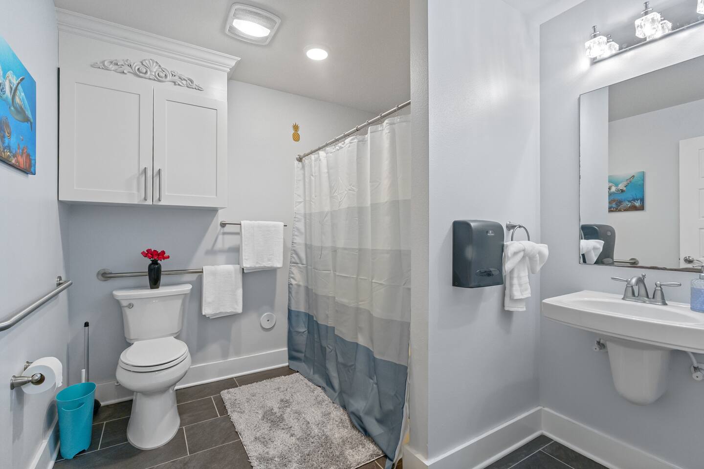 Modern bathroom with grab bars, fresh linens, and gentle touches that make the space feel welcoming.