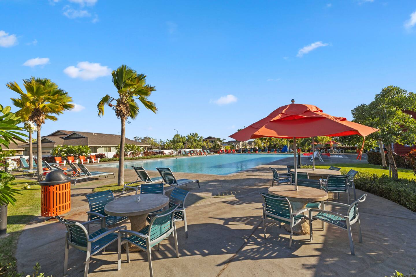 With tropical trees, bright cushions, and shaded seating, this space invites you to relax and recharge.