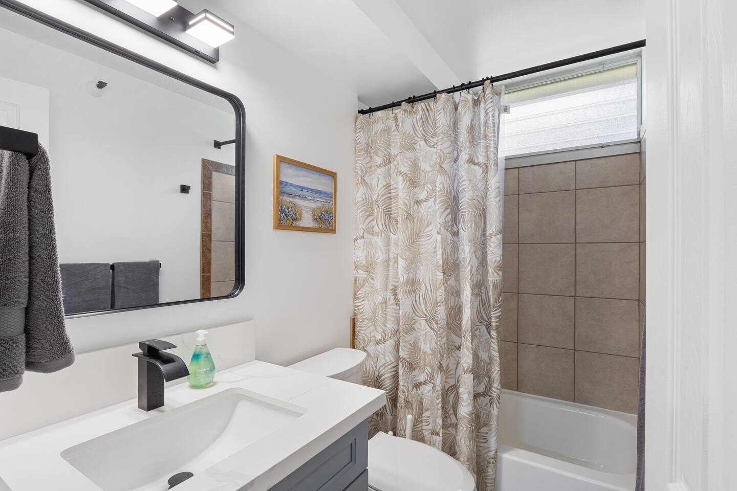 Simple, stylish, and spa-like, this bathroom blends comfort and charm in all the right ways.