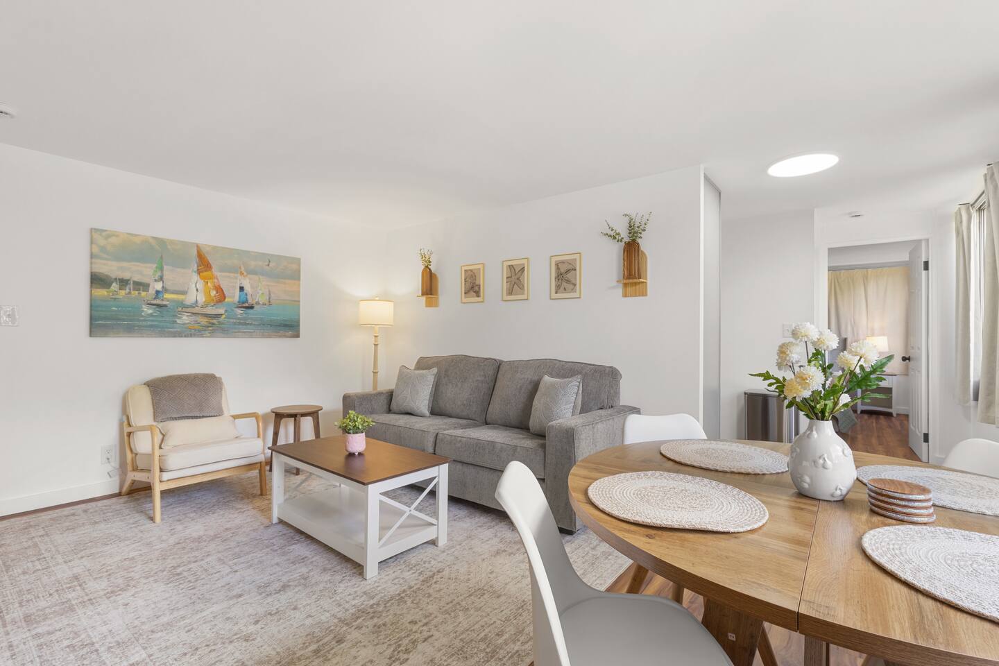 Your everyday escape, where dinner flows into downtime and sailboats drift quietly across the wall.