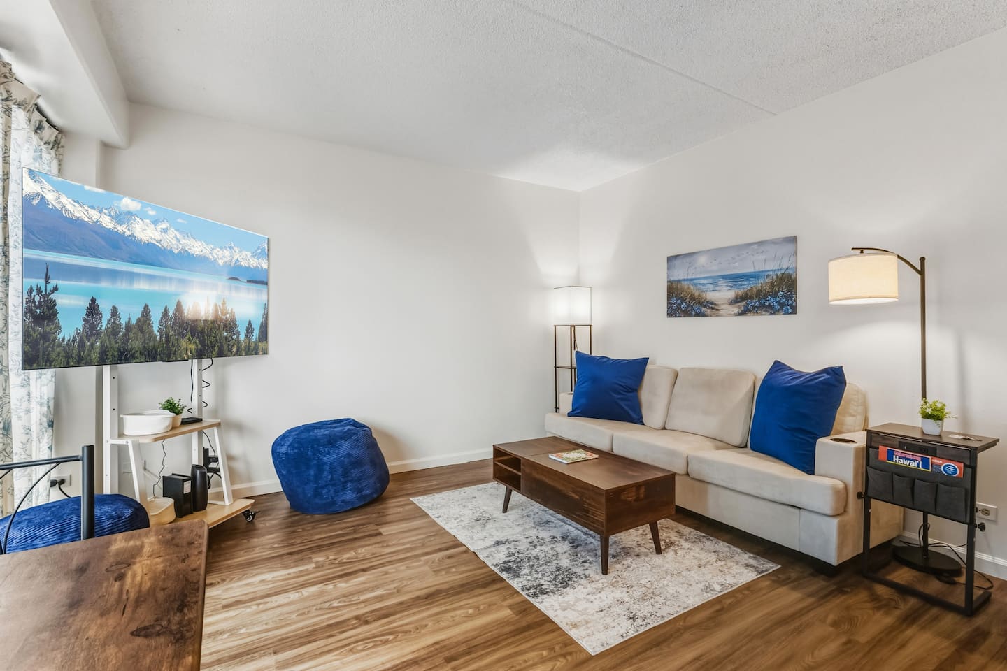 A comfy nook with skyline views and just the right touch of personality. Whether you're binge-watching or journaling by the window, this space makes downtime feel like a treat.