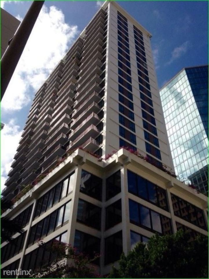 Your modern perch in the city, where glass windows, balconies, and skyline views meet.