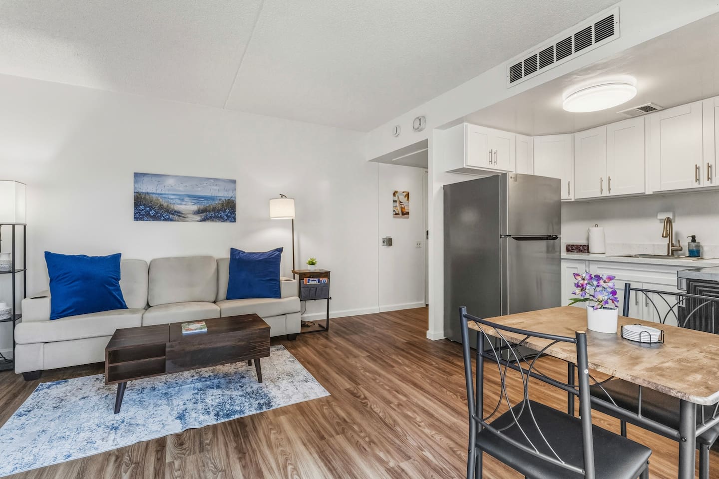 Bright, breezy, and beautifully styled, this open layout features cozy seating, fresh flowers, and a splash of coastal charm.