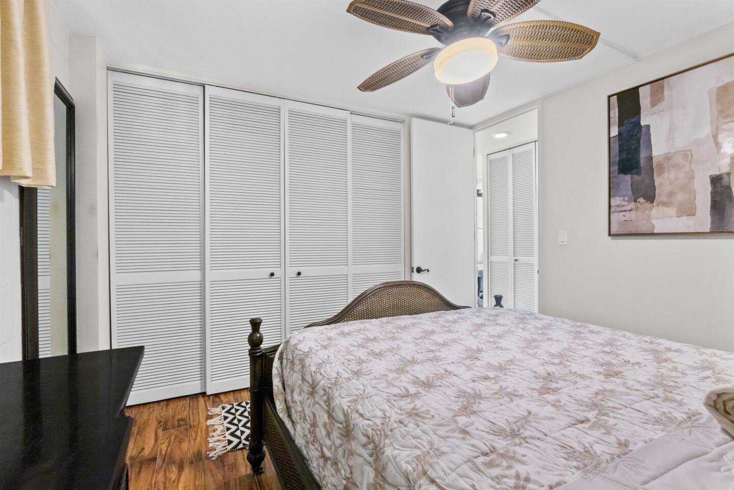 No shortage of closet space here - this wide bedroom closet is perfect for storing your suitcases.