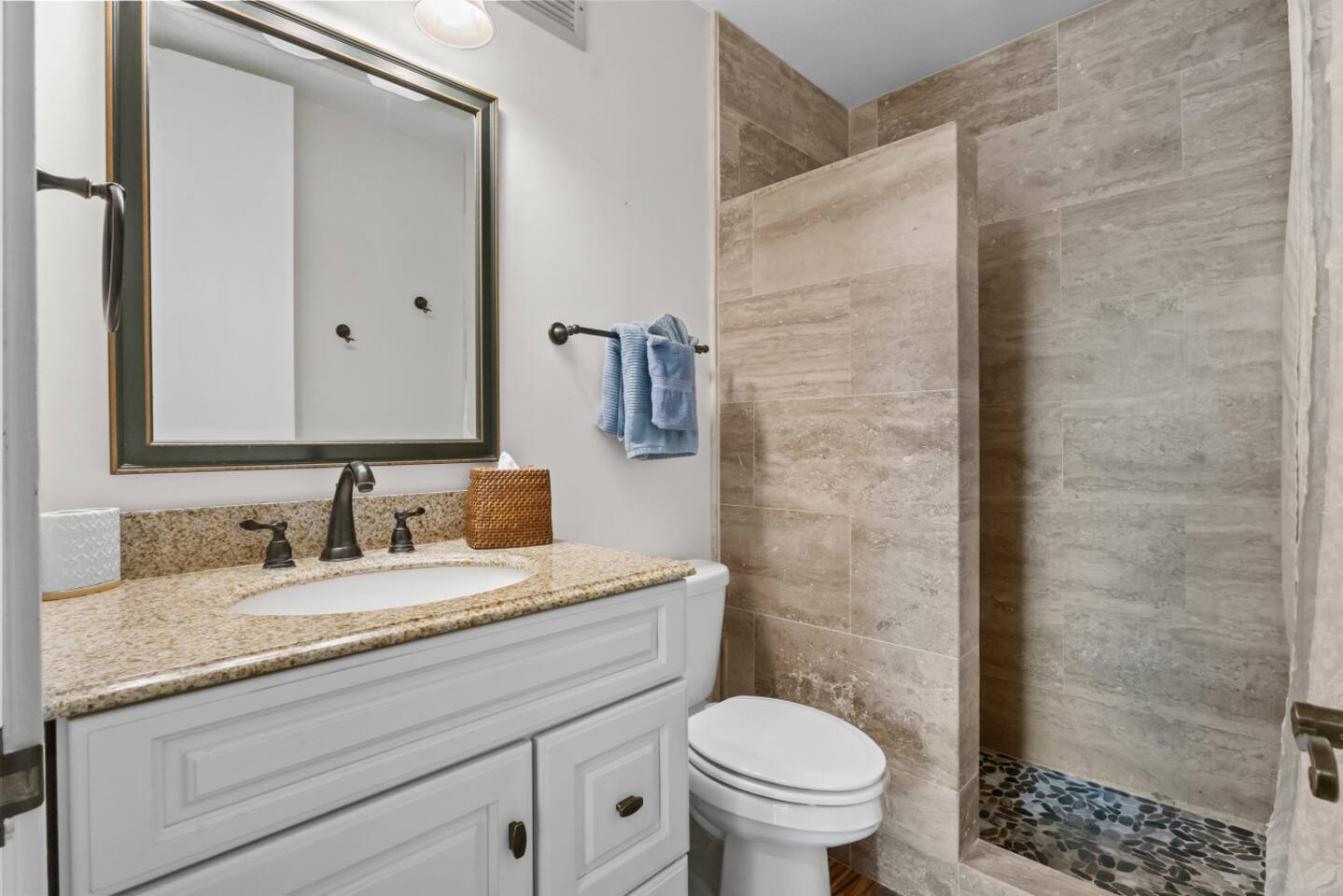 Stone details in this bathroom adds a touch of luxury to your daily routine.
