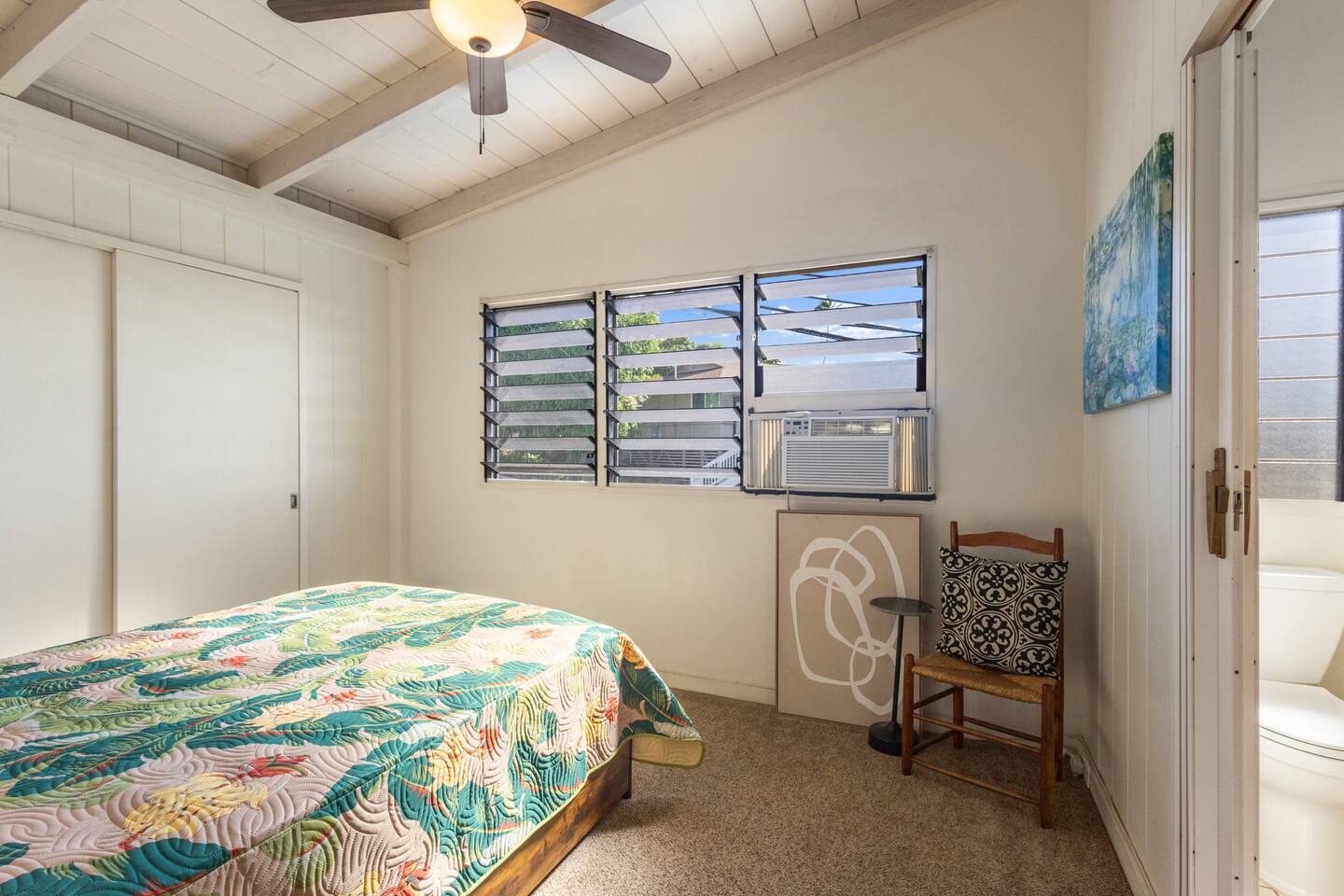 Bedroom four features a small ensuite water closet as well as reading chair and AC.
