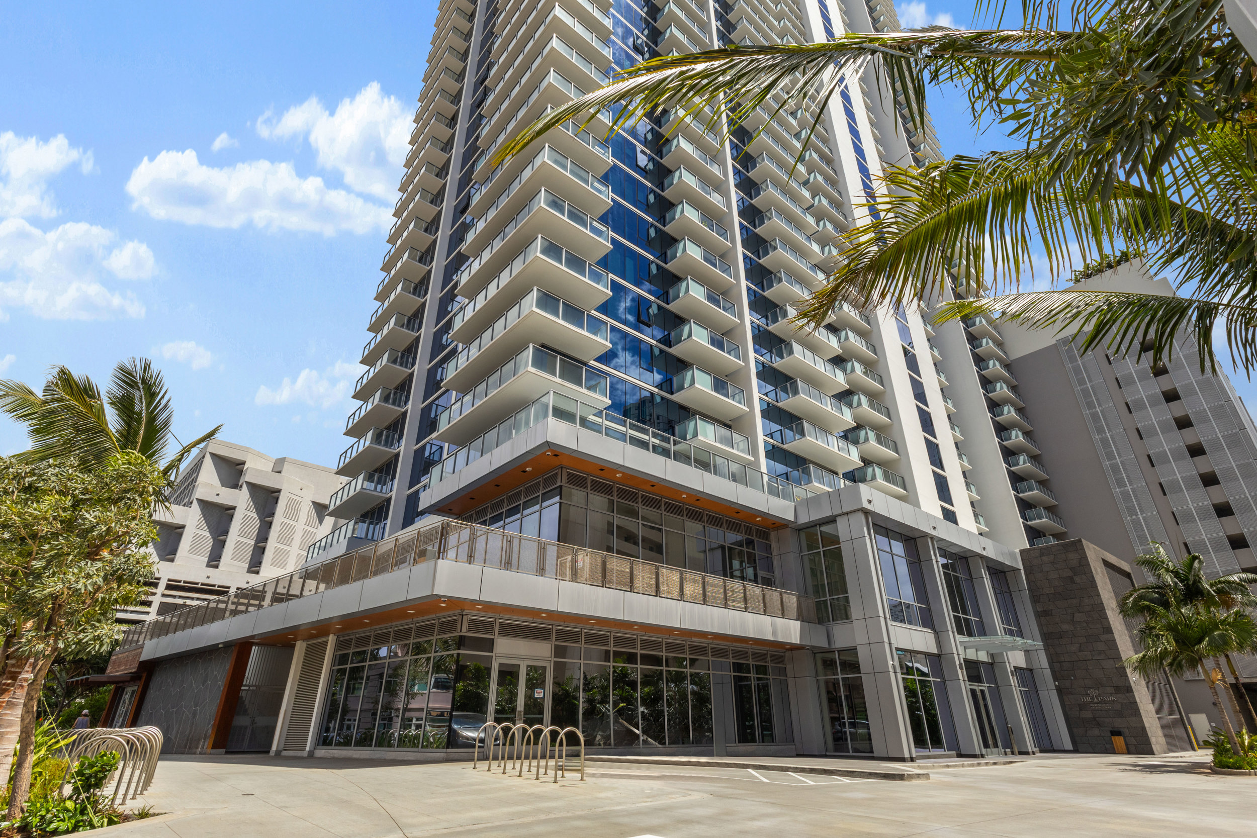 Modern high-rise retreat with balconies, palm views, and upscale city style