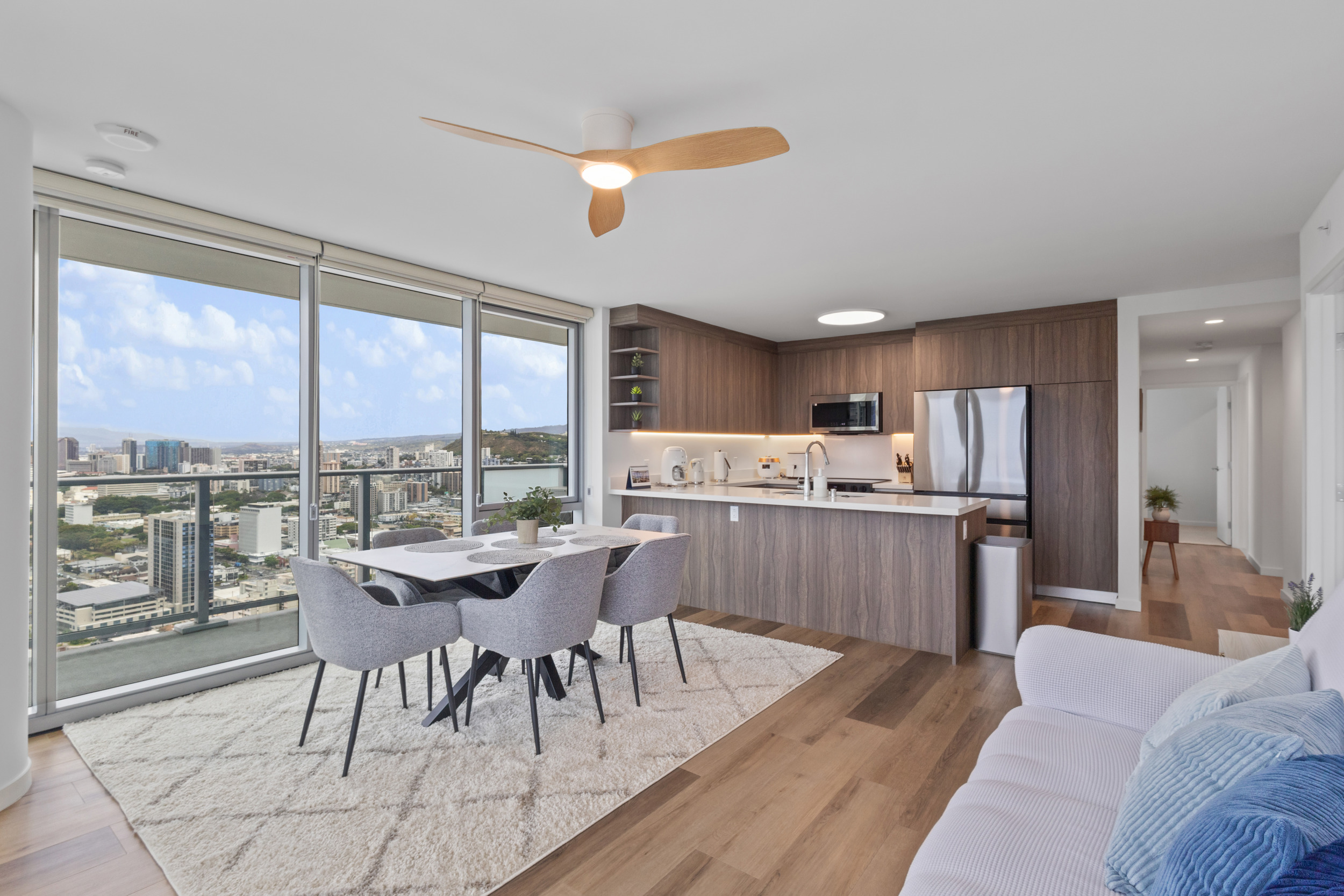 Modern high-rise dining and kitchen with sweeping city views